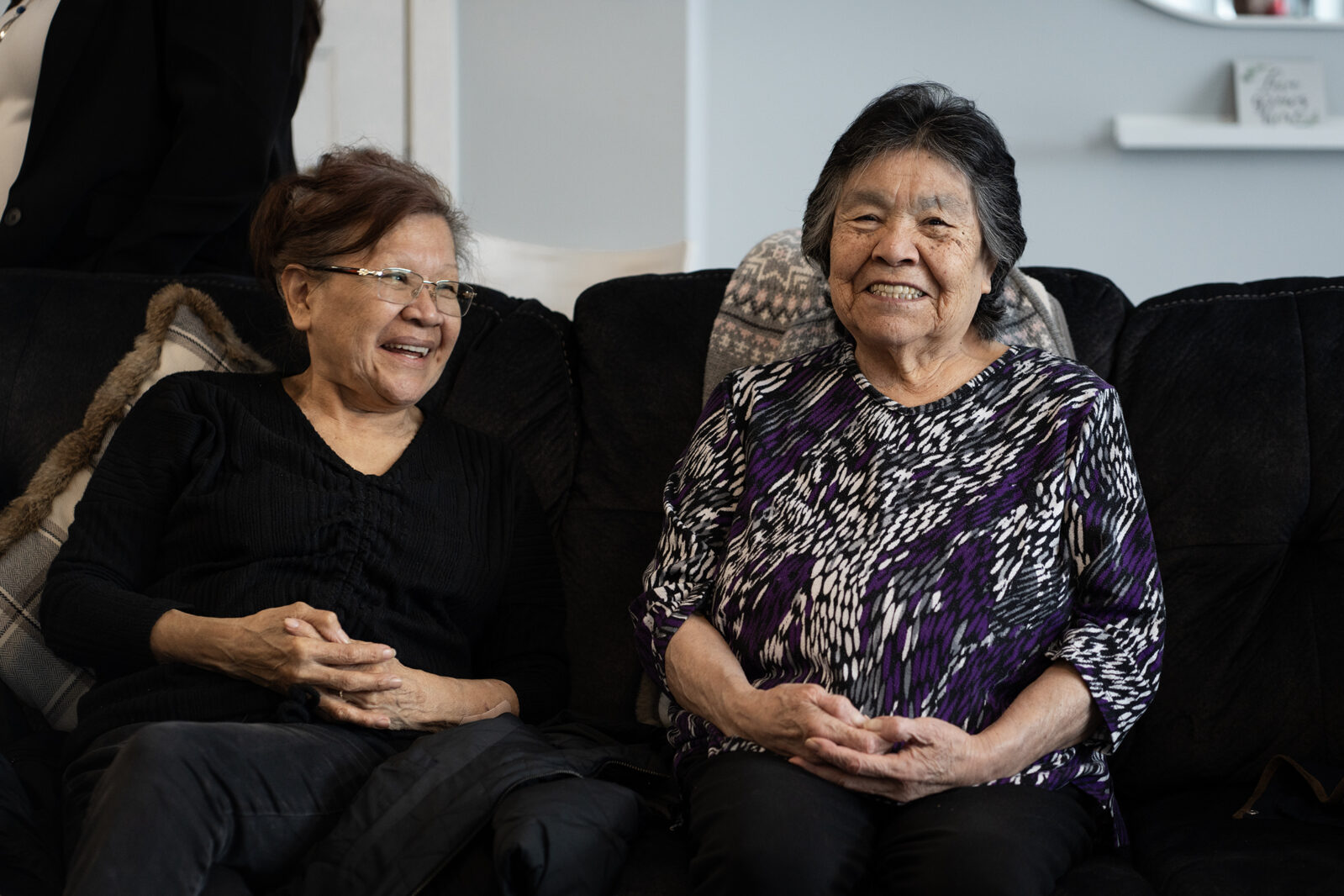 Two BC First Nations Elders participating in a community gathering