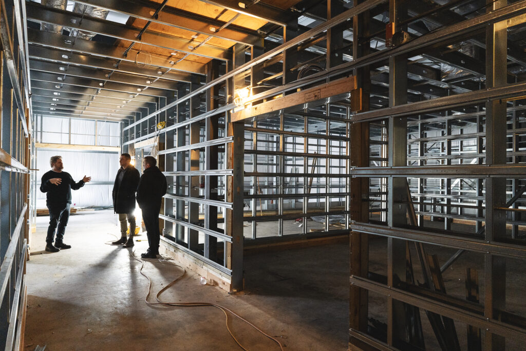 Snuneymuxw cannabis facility under construction with three men inside