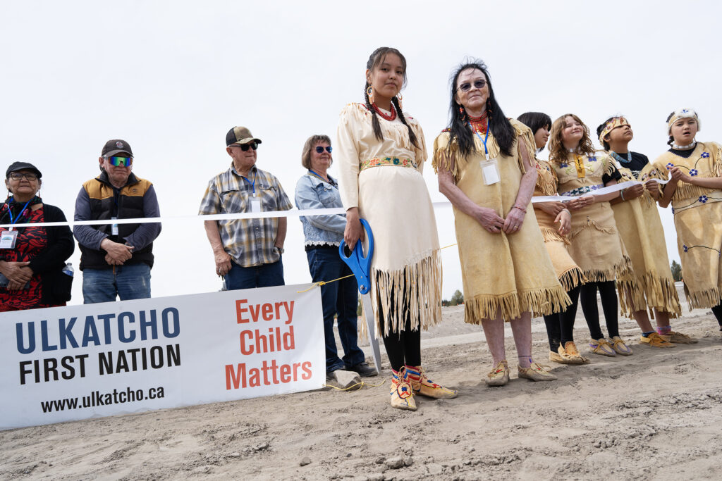 Ulkatcho Nation leaders and community members at the groundbreaking ceremony for a 3.8-megawatt clean energy project reducing diesel reliance.