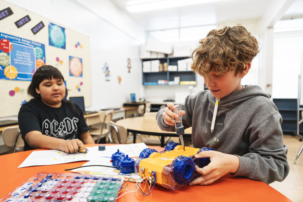 Students at Thornhill using laptops, 3D printers, and coding software through the STEM program supported by the K–12 Education Grant.