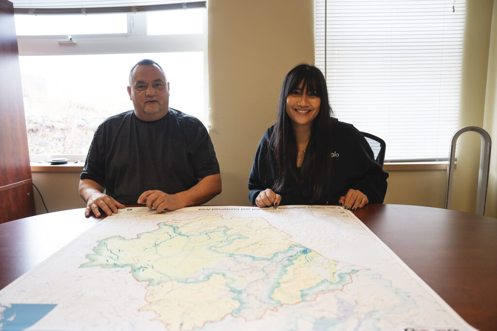 Taku River Tlingit community members reviewing materials as part of Nation Building Grant project